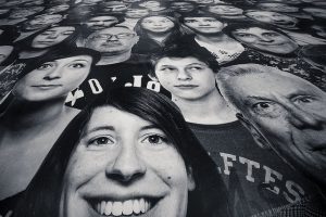 A printed sheet of people's faces