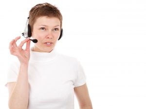 A telemarketer with a phone headset