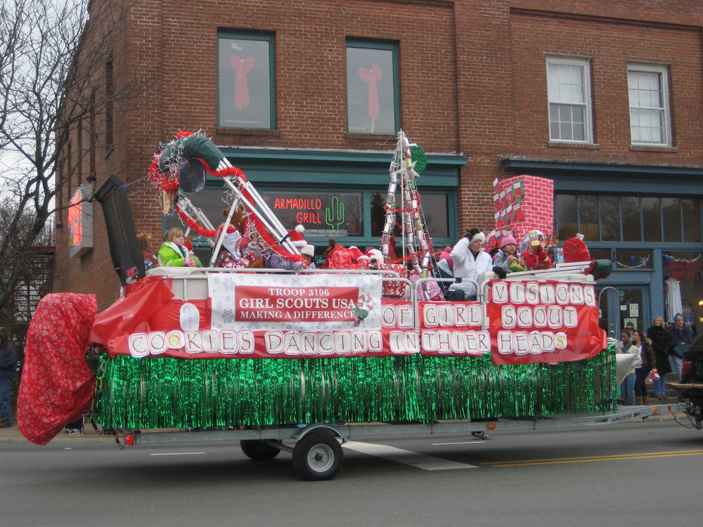 Figure a shows a float made by Girl Scouts.