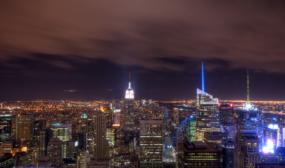 The New York City skyline at night is shown here.