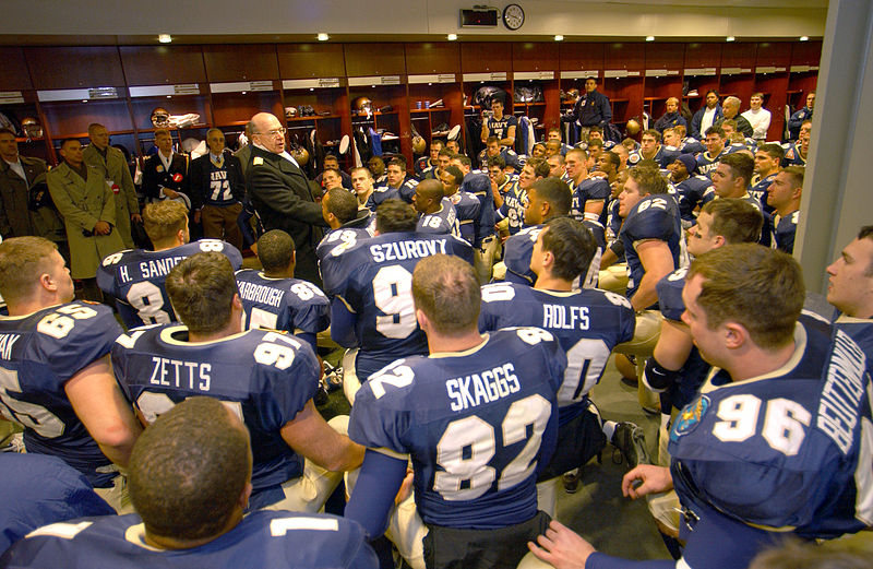 This is a picture of the U.S. Naval Academy's football team in their locker room.