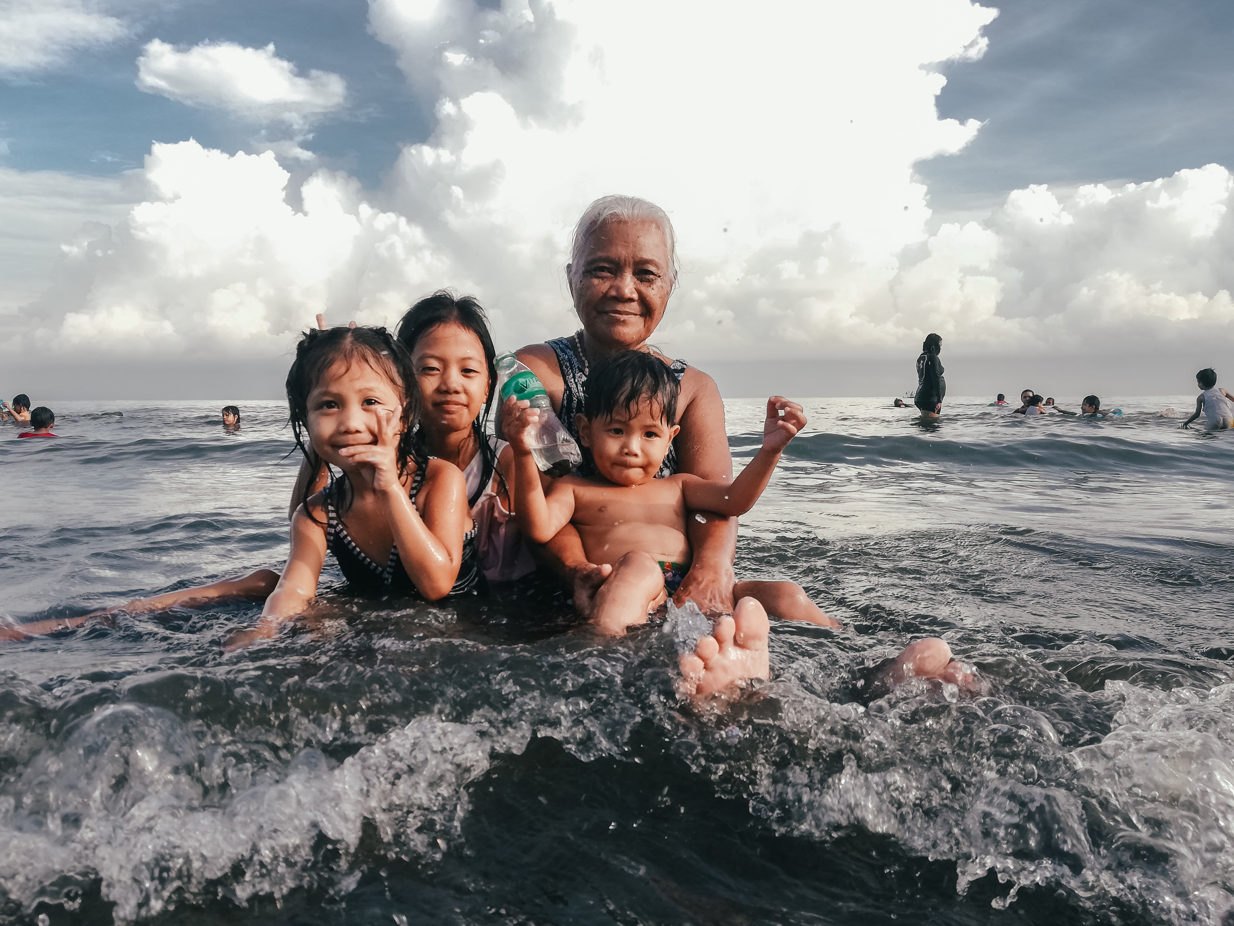 Image shows a family: Grandma and three grandchildren