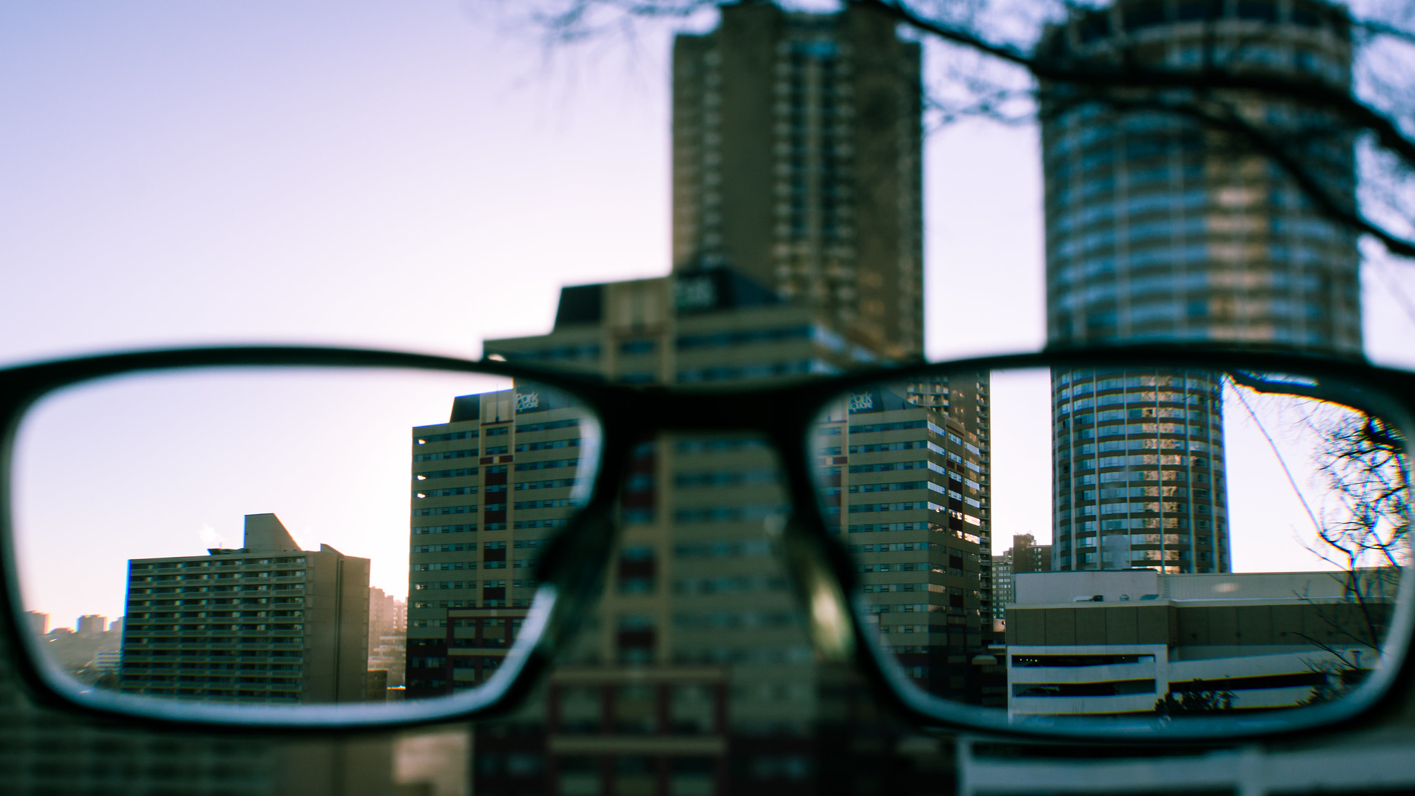 Skyscrapers viewed through eyeglasses.