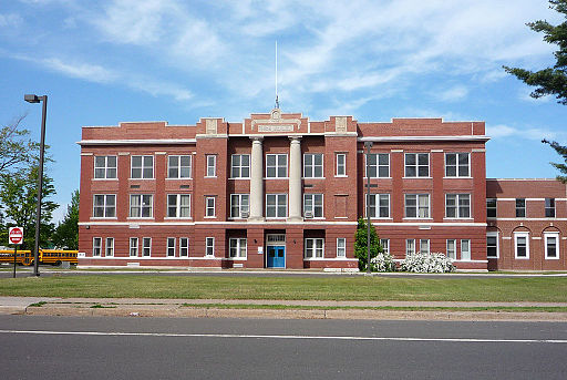 Photo of a tall brick school building.